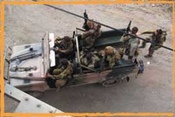 4RAR Commandos scatter rioting gangs at Comoro Bridge Dili Timor Leste June 2006