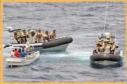 RAN Clearance Divers from HMAS Parramatta detain Somali pirates in the Gulf of Aden.