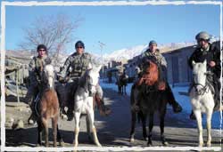 US Special Forces operators conduct presence patrols on horse back in Uruzgan in 2010.