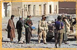 An Australian SASR operator hires local security for anti al Qaida ops in Afghanistan in early 2002