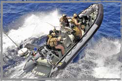 RAN Clearance Divers from HMAS Stuart's Enhanced Boarding Party rehearse counter piracy ops on a RHIB.