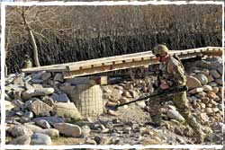 An MTF3 High Risk Clearance Team Sapper checks for IEDs near PB Wali in Mirabad Afghanistan.