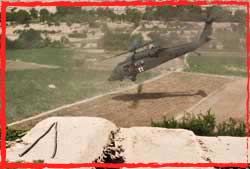 A US Army UH-60A Black Hawk AME helo extracts a wounded SEAL from Uruzgan Afghanistan.
