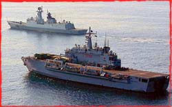 An Italian LSD and Chinese frigate pursue Somali Pirates in the Gulf of Aden